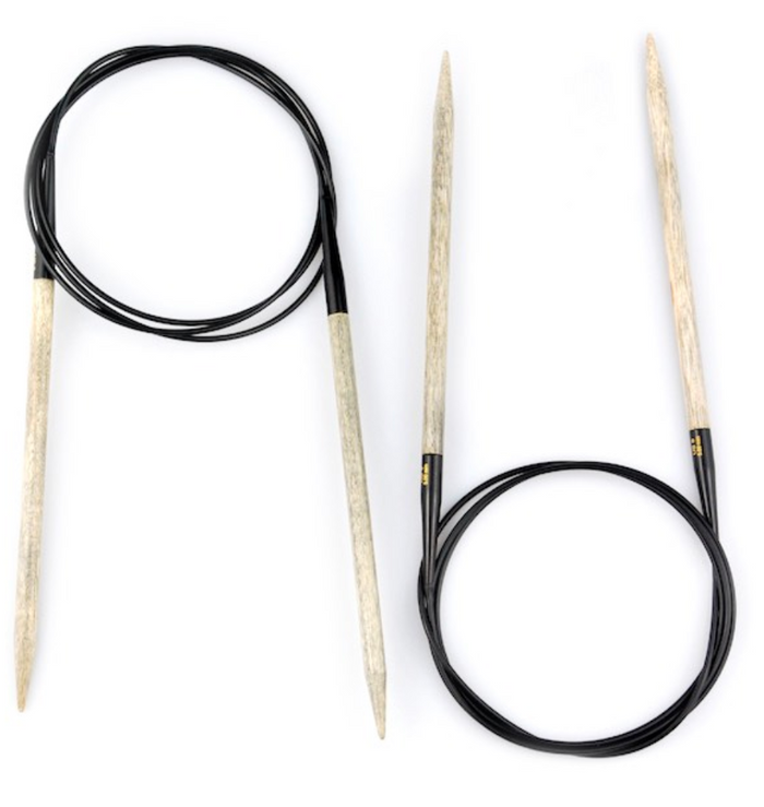 2 pairs of Fixed Circular Needles on white background; Needles shown in light gray driftwood-like color with black cables connecting them