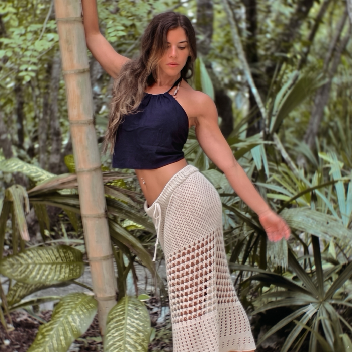 FEMBODYment: An Embodied Yoga Journey and Sound Bath participant in nature with sensual movement.