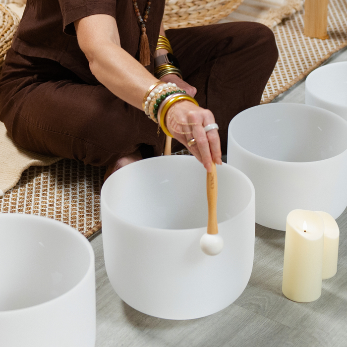 STURGEON MOON BREATHWORK & SOUND JOURNEY practitioner preparing sound bowls for reflection and restoration.