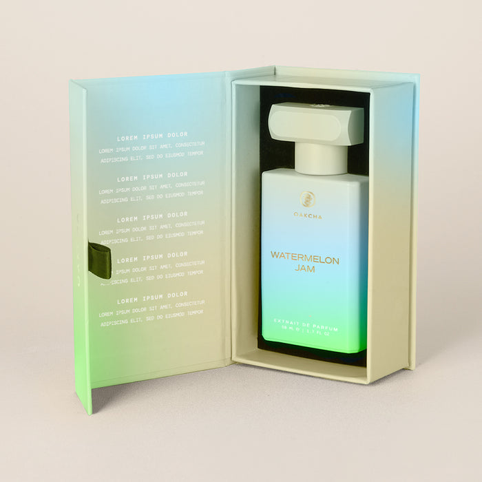 Three-quarter view of Watermelon Jam bottle in open presentation box showcasing gradient green-to-white label and fitted insert on light background