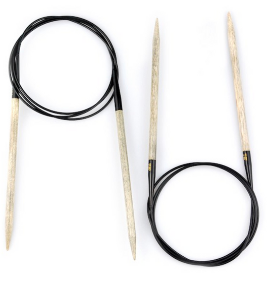 2 pairs of 32" circular knitting needles made of light grayish birch wood with black cables connecting each on a white background