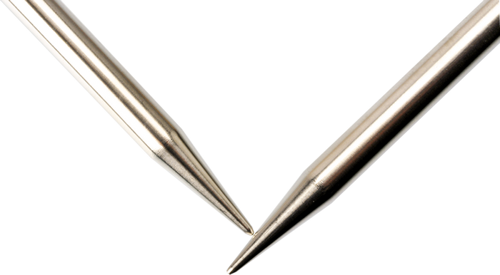 Close up of stainless steel circular knitting needle tips; satin-sheen shine on needles catching the light