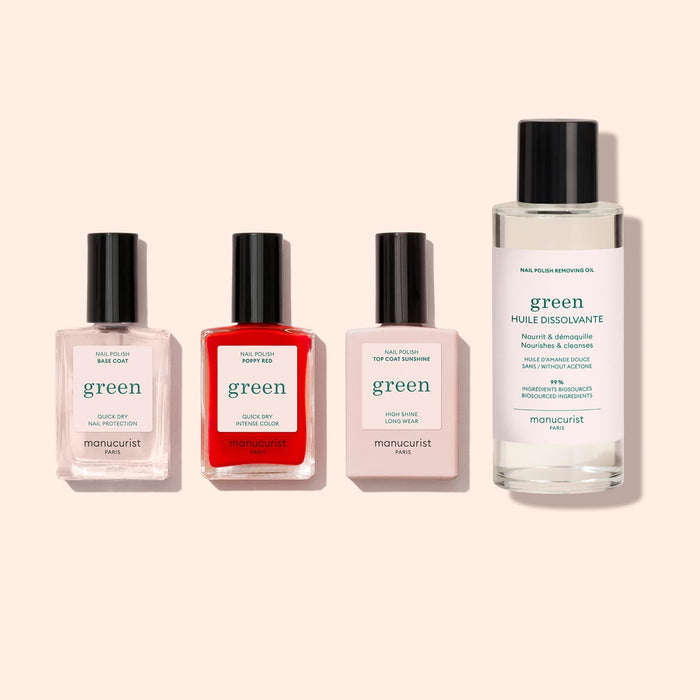 The Manucurist Basic Kit features three gel-effect polishes (pink, red, clear) in rectangular bottles and a larger acetone-free nail polish remover oil, all upright—an ideal set for a perfect green manicure.