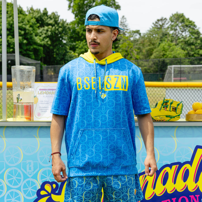 Adult model wearing blue short sleeve hoodie with "BSBL-SZN V3" design