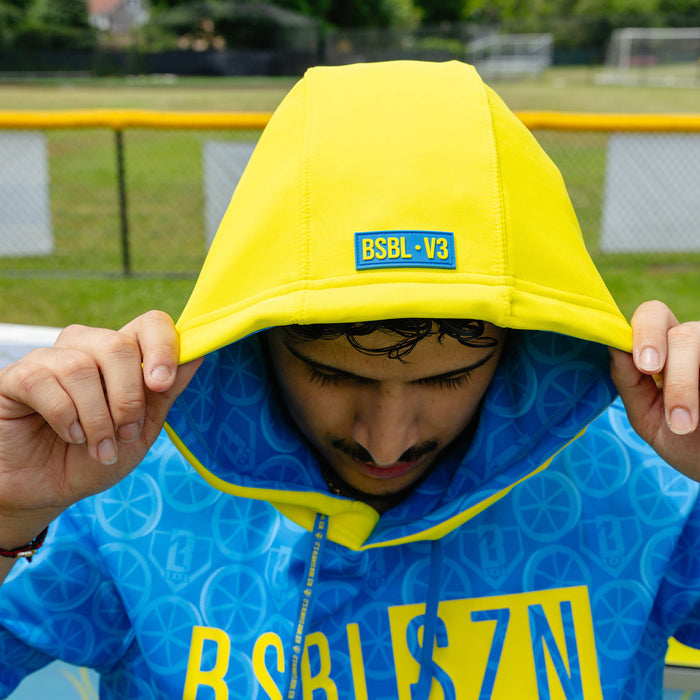 Adult model wearing blue short sleeve hoodie with "BSBL-SZN V3" design
