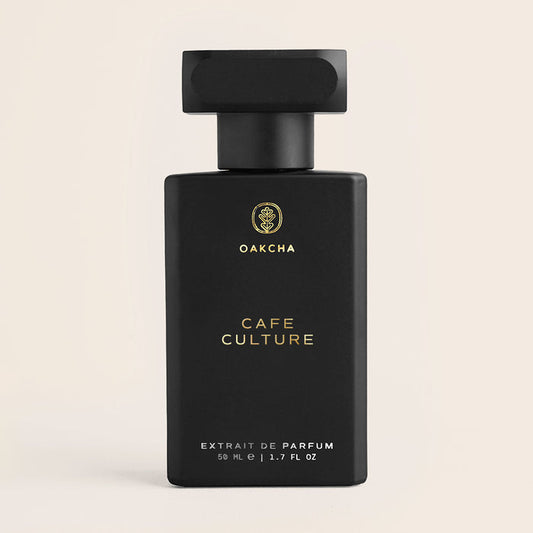 Front view of Cafe Culture perfume bottle showcasing matte black rectangular bottle with gold Oakcha logo and ‘Cafe Culture’ text on a beige background
