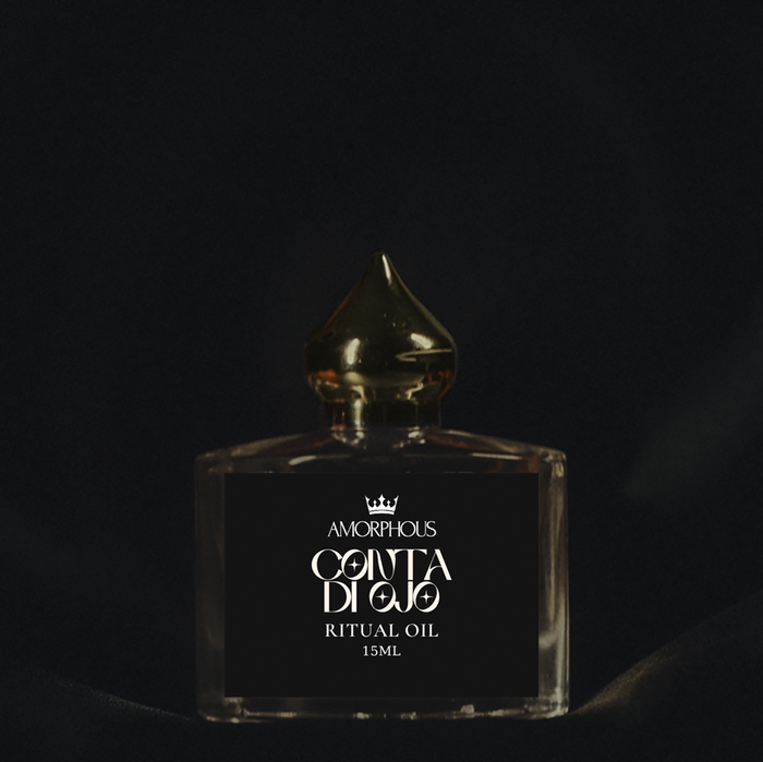 Amorphous Conta di Ojo Ritual Oil bottle on a dark background