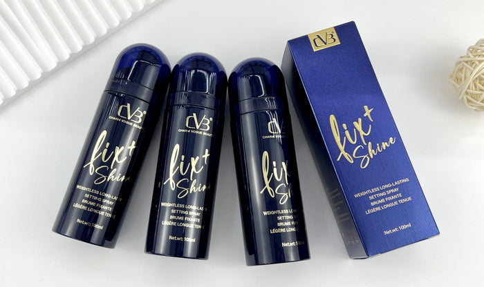 Three bottles of 'fix+Shine' hair product with a box on a white background