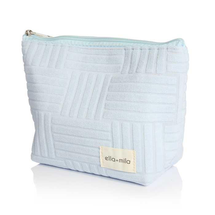 Ella's Essentials light blue quilted cosmetic pouch with ella+mila label