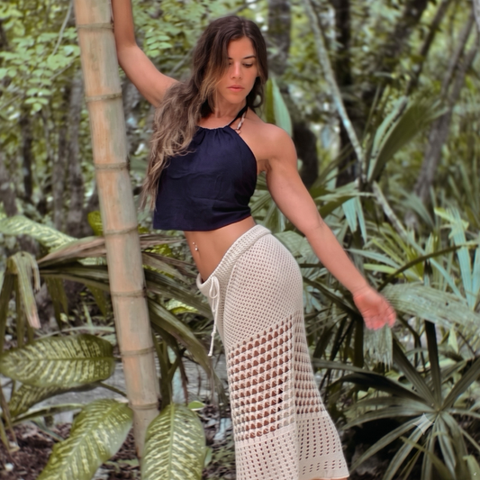 FEMBODYment: An Embodied Yoga Journey and Sound Bath participant in nature with sensual movement.
