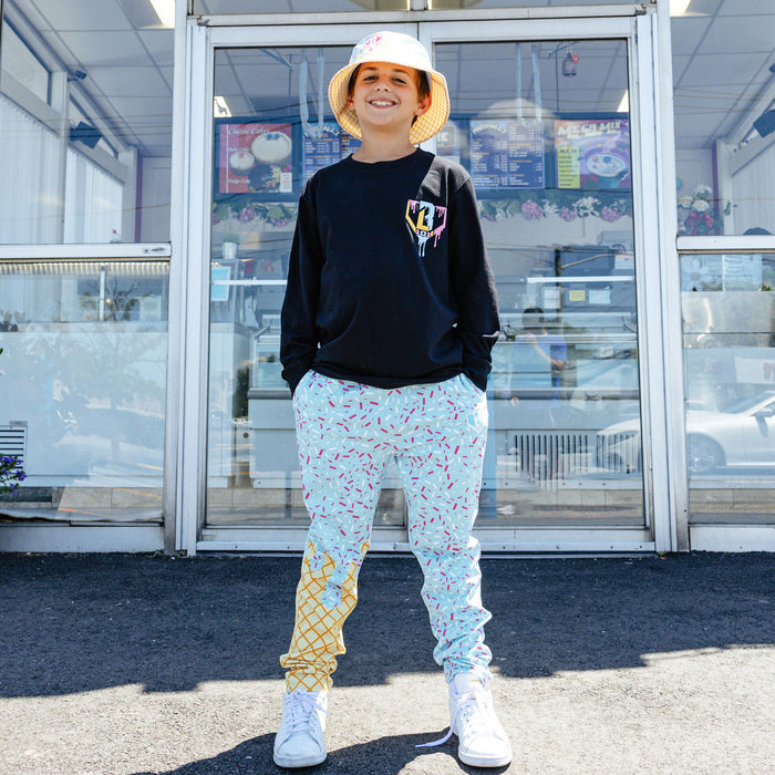 Youth model wearing ice Cream Pajama Pants Cotton Candy Blue youth pants