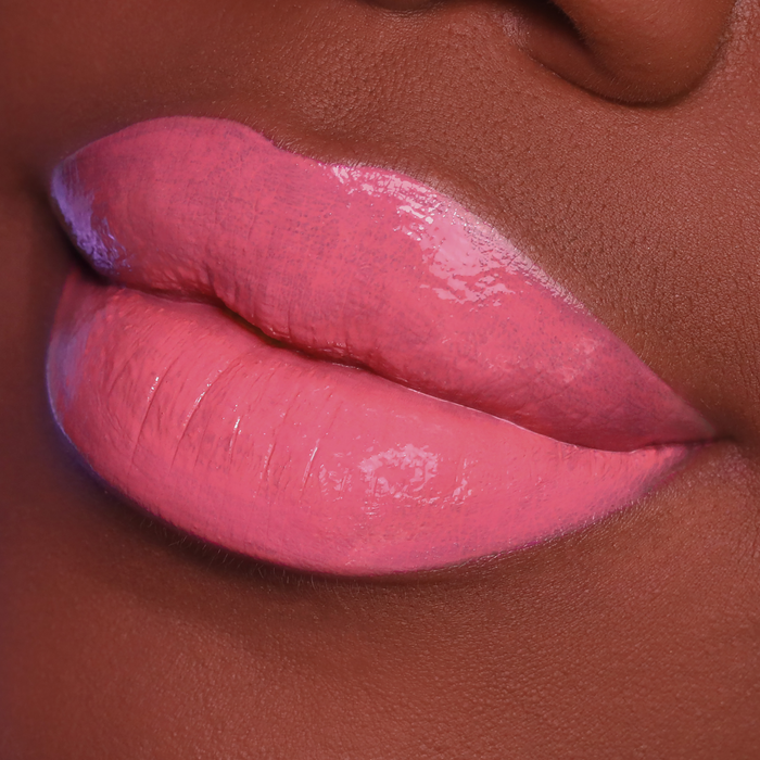 Creamy Lips It's Complicated rose pink lipstick on lips, deep skin tone close-up
