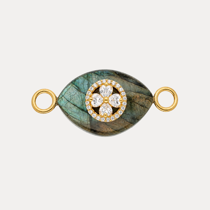 Labradorite Clover Charm featuring a golden clover medallion encrusted with crystals on an iridescent labradorite stone.