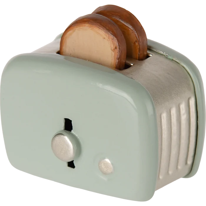 Small toaster with two slices of bread on a white background