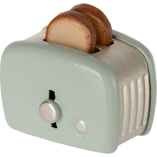 Small toaster with two slices of bread on a white background