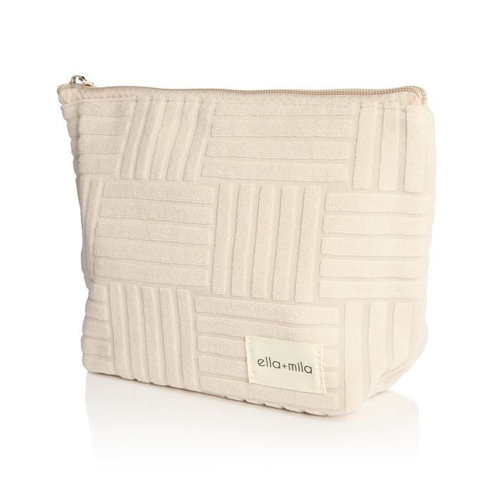 Mila's Must-Haves cream quilted cosmetic pouch, front view