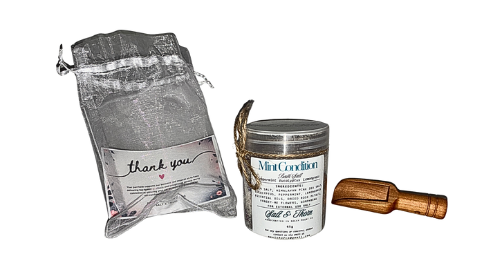 Product packaging with a drawstring bag, a tin labeled 'Mint Condition', and a wooden tool on a white background.