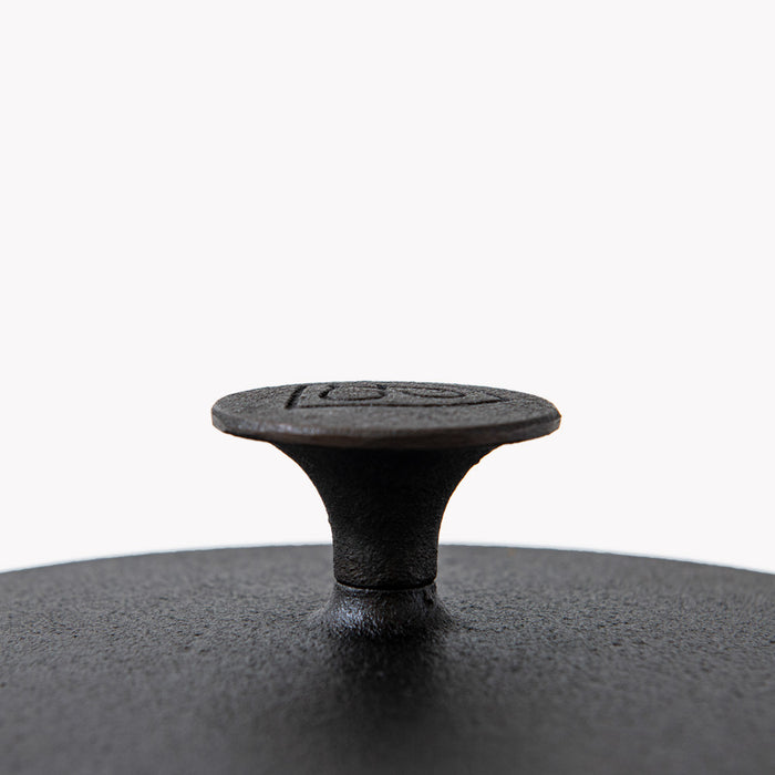Close-up of the flared cast iron knob on the Field Skillet Lid