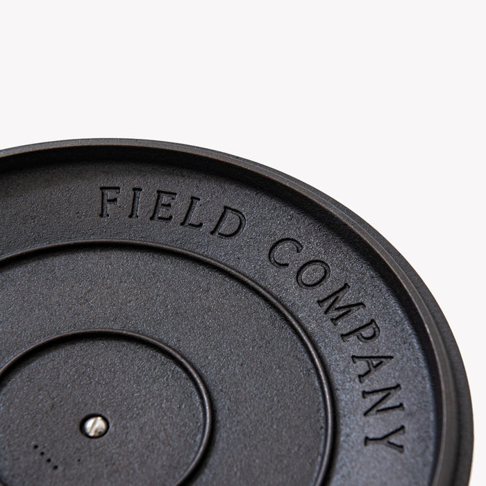 Close-up of the underside of a Field Cast Iron Skillet Lid showing the Field Company stamp
