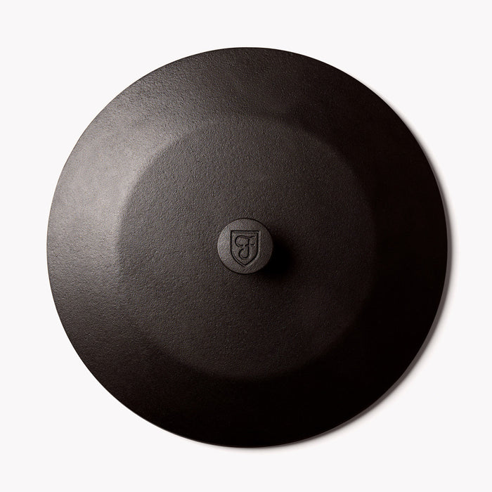Overhead view of the No.12 Field Cast Iron Skillet Lid with shield-stamped center knob