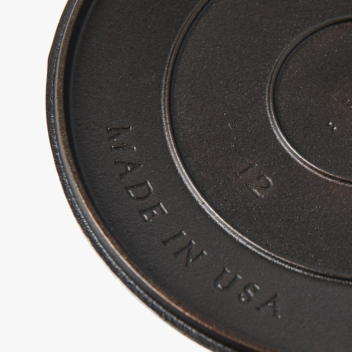 Close-up of the underside of the No.12 Field Cast Iron Skillet Lid showing the Made in USA stamp