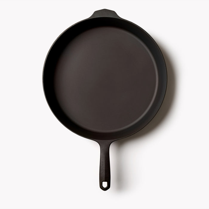 Overhead view of the No.12 Field Cast Iron Skillet on a white background, helper handle at top