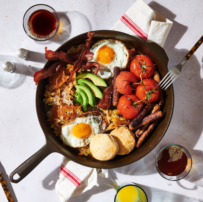 Skillet breakfast of fried eggs, bacon, avocado, and tomatoes in the No.12 Field Cast Iron Skillet