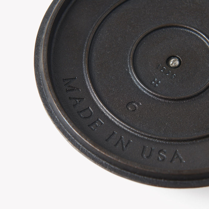 Close-up of the underside of the No.6 Field Cast Iron Skillet Lid showing the Made in USA stamp