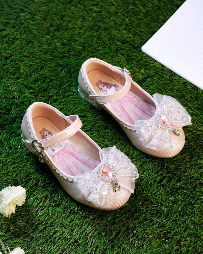 Girls' pink and silver sandals with bow and bead embellishment, ankle strap