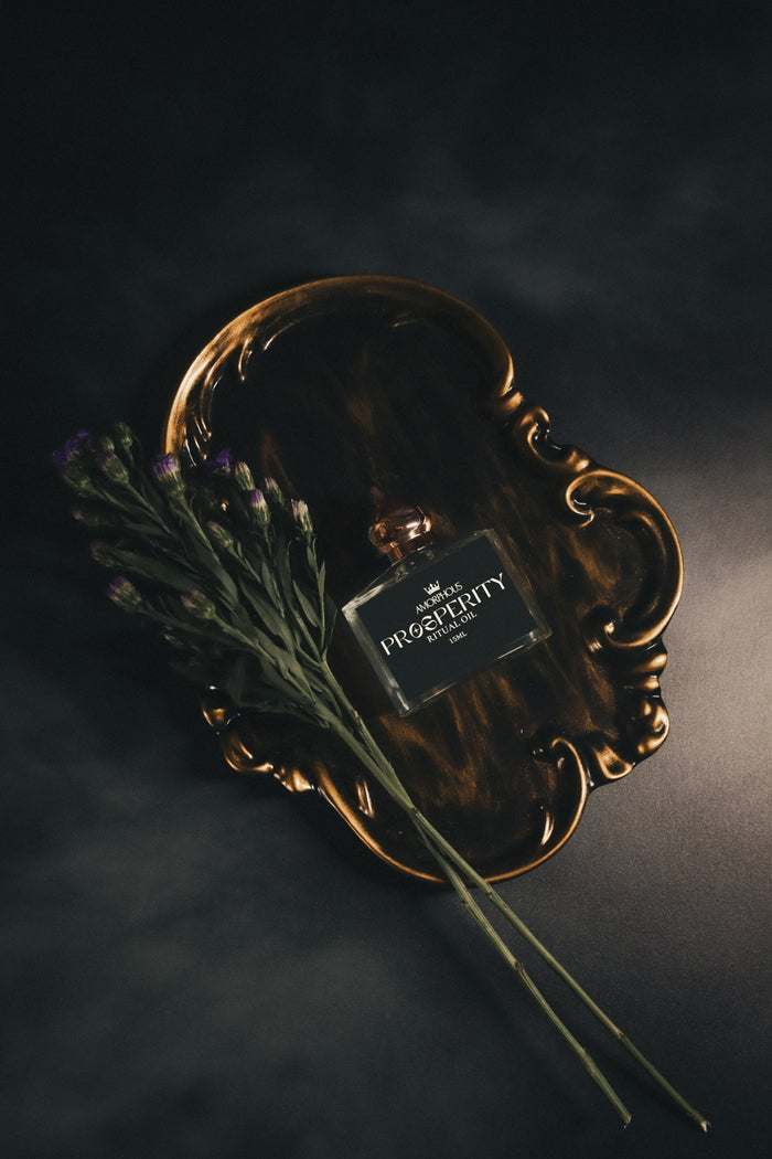 Perfume bottle with lavender on a dark background