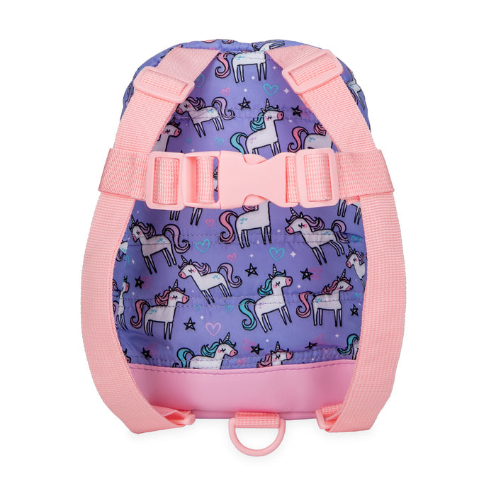 The Quilted Backpack with Safety Harness is a toddler bag with pink straps, a purple background, white unicorns, stars, hearts, rainbows, and pink front clasp and bottom. It includes a child safety harness for security on the go.
