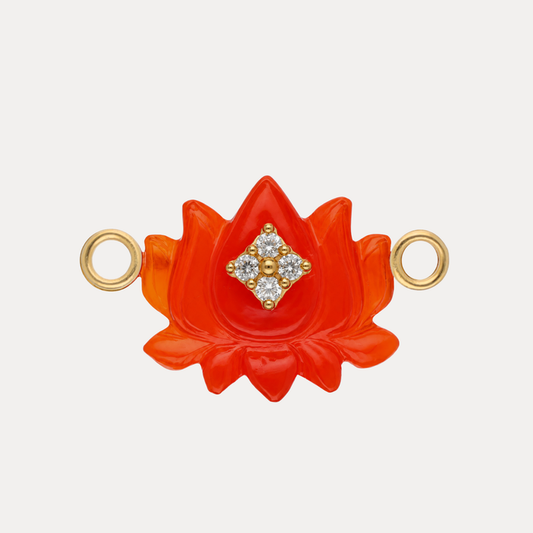 Red Chalcedony Lotus Charm showcasing vibrant red hues and delicate details with a sparkling center.