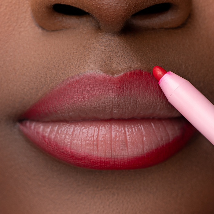 Red Everlasting Lip Liners Lip model of Pink Lipps Everlasting 'Red' Lip Liner showcasing vibrant red on melanin skin tone and lips
