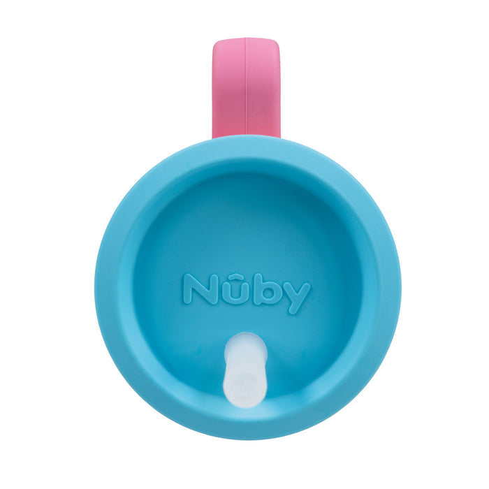Blossom Silicone Tiny Tumbler featuring a blue lid, white spout, and pink handle as seen from above; this spill-proof cup is perfect for toddlers learning to drink independently.