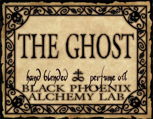 Label for 'The Ghost' hand blended perfume oil by Black Phoenix Alchemy Lab with decorative border.