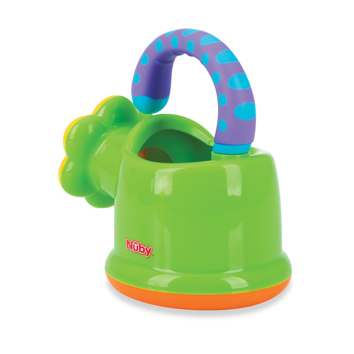 A colorful plastic bath toy for toddlers called the Watering Can by Nuby, with a green base, orange bottom, blue and purple spotted handle resembling a watering can, and a flower-shaped backrest. Nuby's logo is printed on the side.